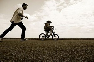 dad letting son ride himself
