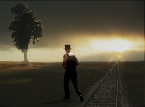 man walking away into the sunset