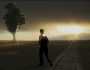 man walking away into the sunset