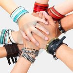 hands-of-young-guys-and-girls-showing-unity-thumb5828358