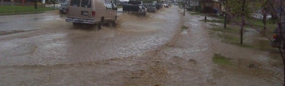 Commerce during the flood Several people are trapped in their vehicles on one of the main routes through town during the flood
